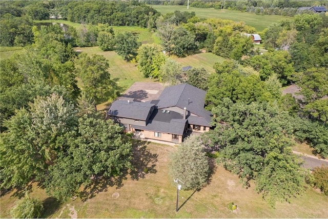 birds eye view of property with a rural view