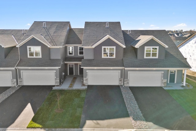 view of front facade with a garage and a front lawn