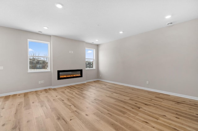 unfurnished living room featuring light hardwood / wood-style floors