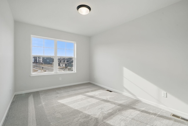 6566 Jody Ave S, Cottage Grove, MN 55016 - carpeted spare room with baseboards and visible vents