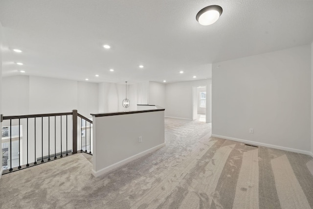 6566 Jody Ave S, Cottage Grove, MN 55016 - spare room with light colored carpet, recessed lighting, and visible vents
