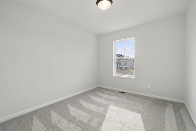6566 Jody Ave S, Cottage Grove, MN 55016 - empty room featuring carpet floors, baseboards, and visible vents