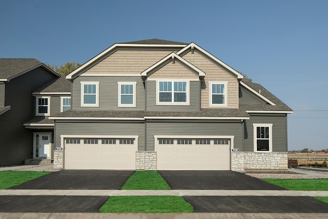 craftsman house with a garage