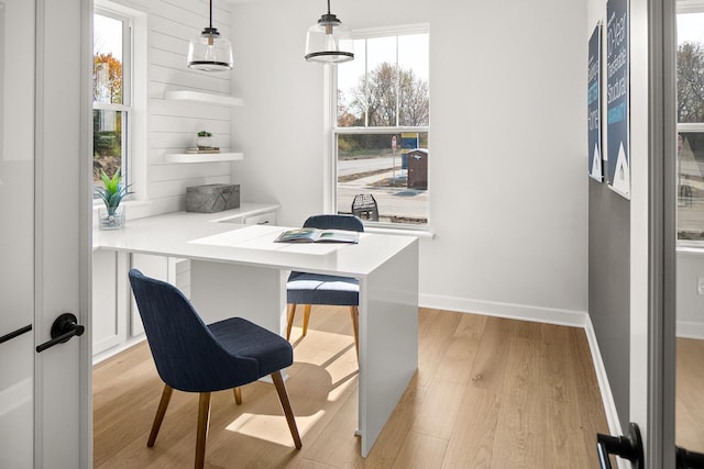 office with light wood finished floors and baseboards