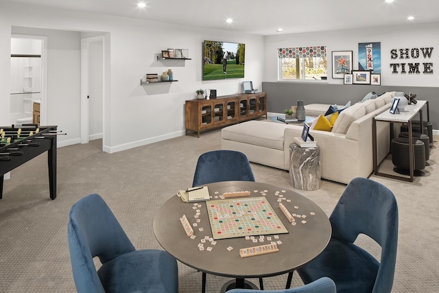 carpeted living area featuring baseboards and recessed lighting