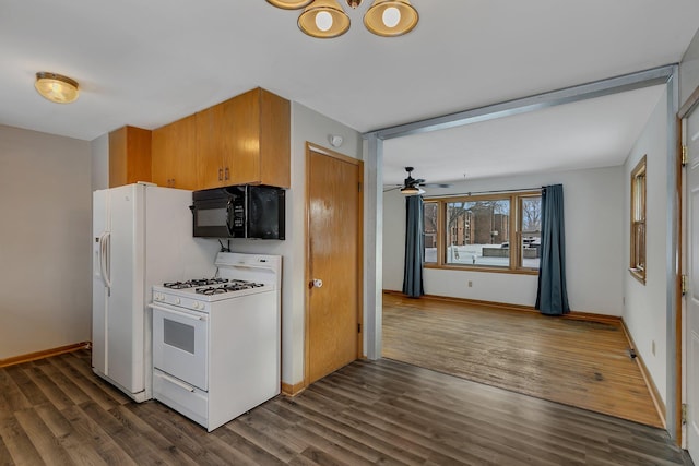 kitchen featuring white appliances, dark hardwood / wood-style floors, and ceiling fan