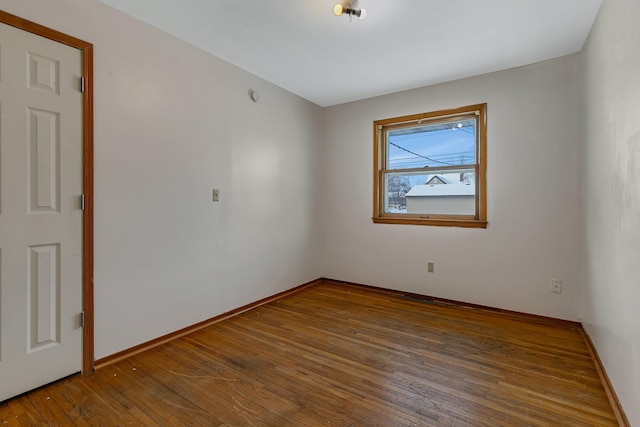 unfurnished room featuring dark hardwood / wood-style floors