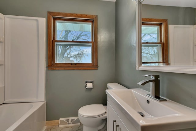 bathroom with vanity and toilet