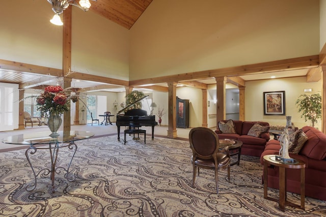 living room with decorative columns, wood ceiling, high vaulted ceiling, and beamed ceiling