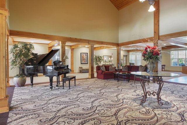 living room with high vaulted ceiling, beam ceiling, and decorative columns