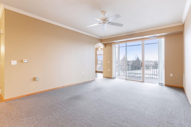 unfurnished room featuring crown molding, carpet, ceiling fan, and a textured ceiling