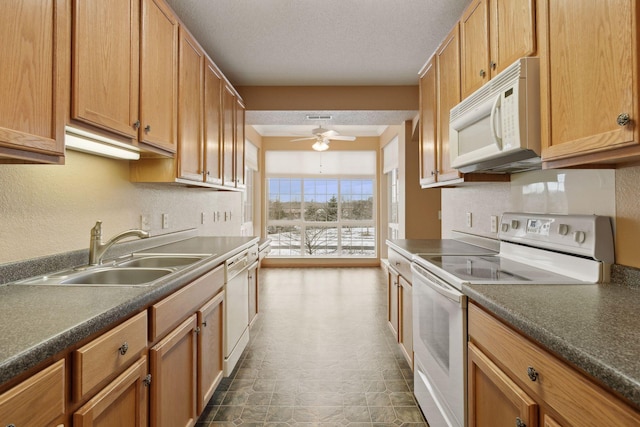 kitchen featuring sink, white appliances, ceiling fan, tasteful backsplash, and a textured ceiling