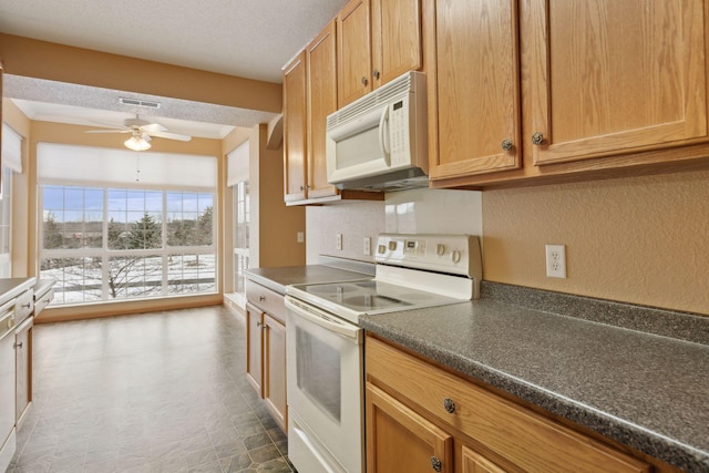 kitchen featuring backsplash, white appliances, a textured ceiling, and ceiling fan