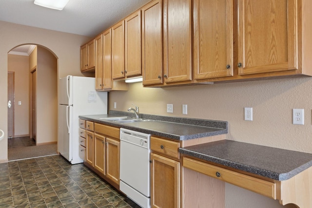 kitchen featuring white appliances and sink