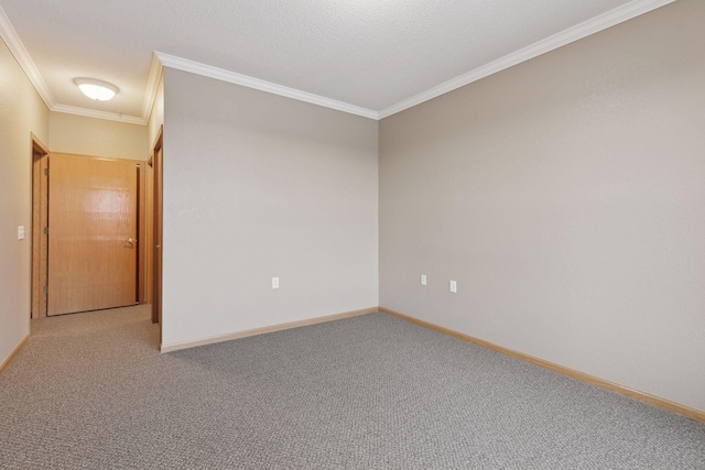 carpeted spare room featuring crown molding and a textured ceiling