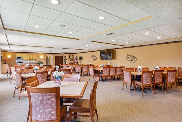 dining space with light carpet