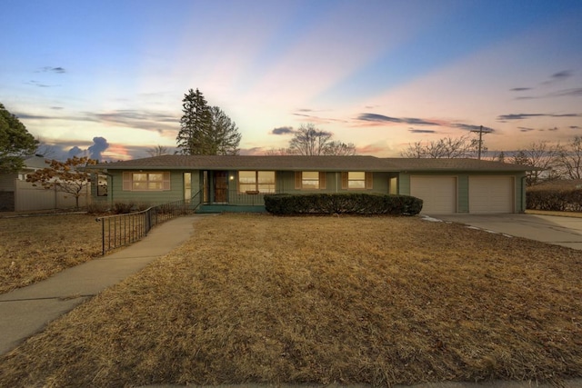 single story home with a yard and a garage