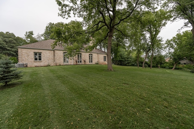 view of yard with central AC unit