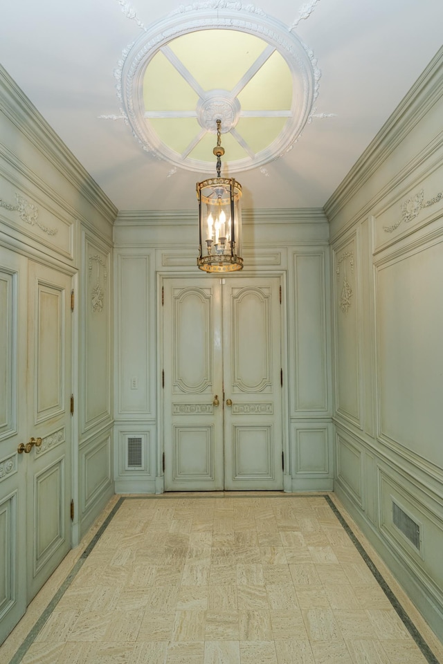 interior space with light floors, visible vents, and an inviting chandelier