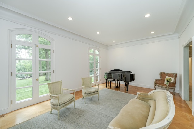 sitting room featuring recessed lighting, ornamental molding, and french doors