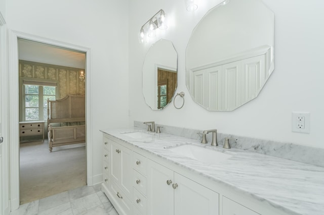 bathroom featuring a sink and double vanity