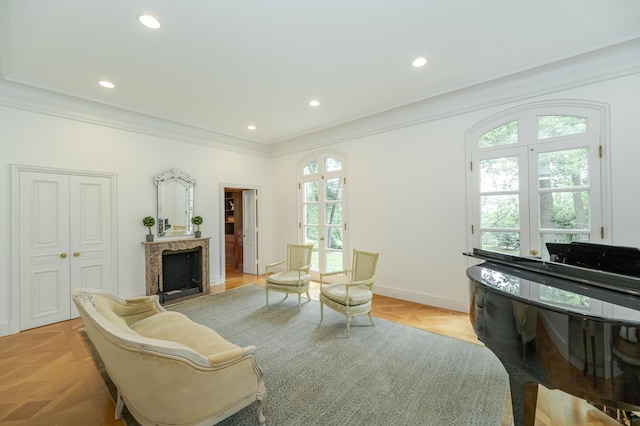 910 Folwell Dr SW, Rochester, MN 55902 - sitting room with recessed lighting, baseboards, ornamental molding, and a premium fireplace