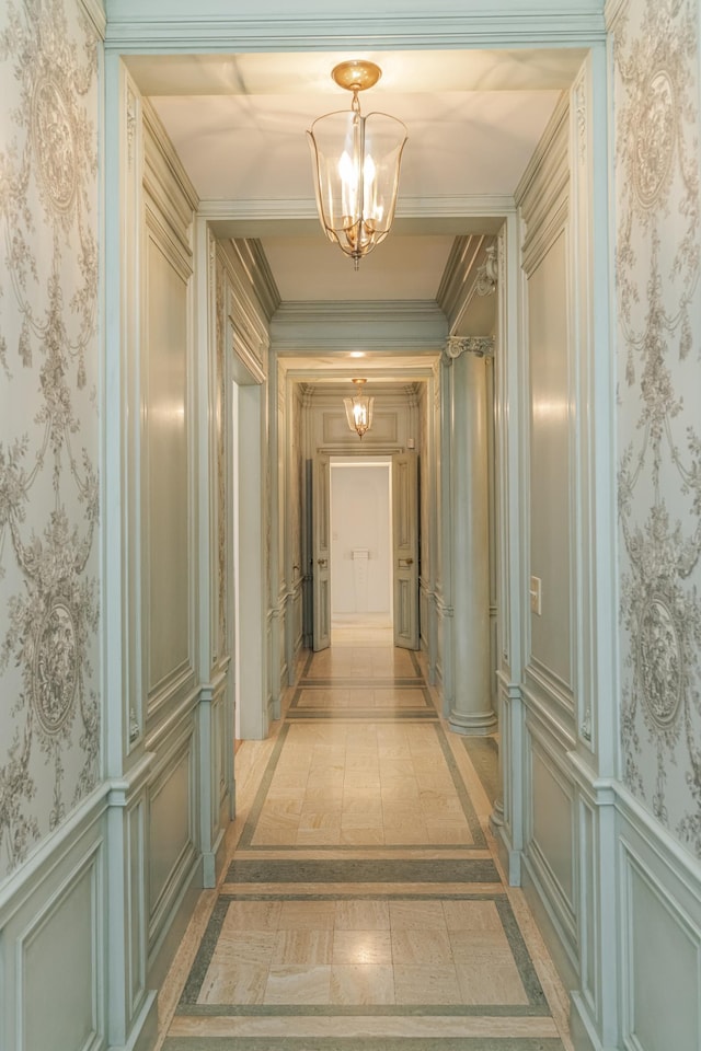 910 Folwell Dr SW, Rochester, MN 55902 - hallway featuring a chandelier, a decorative wall, wallpapered walls, and a wainscoted wall