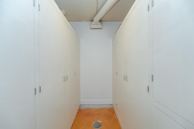 910 Folwell Dr SW, Rochester, MN 55902 - hallway featuring baseboards and unfinished concrete floors
