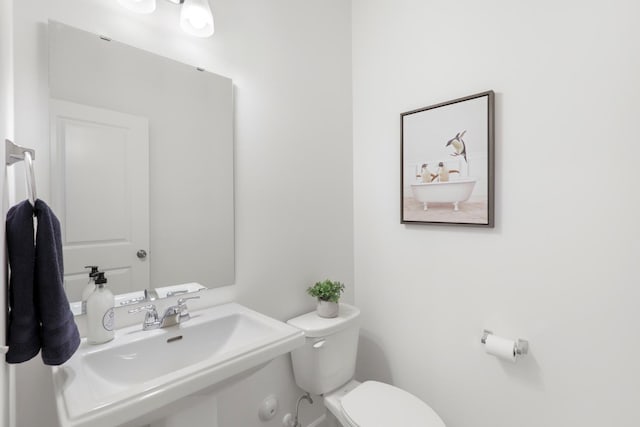 bathroom with sink and toilet