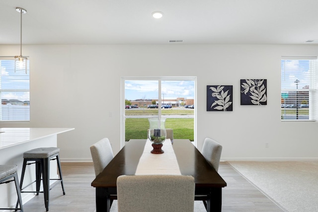 dining room with light hardwood / wood-style flooring