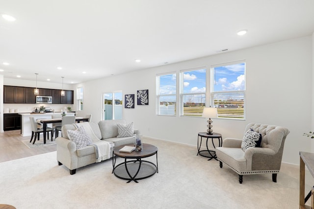 living room with light colored carpet