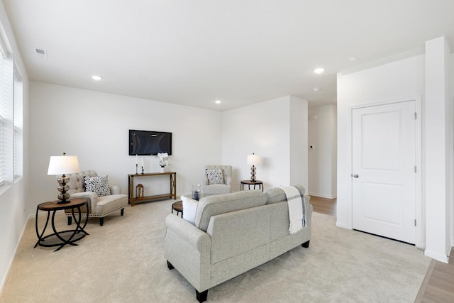 living room featuring light carpet