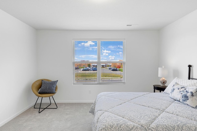 bedroom featuring light carpet