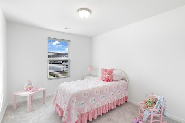 bedroom with light carpet