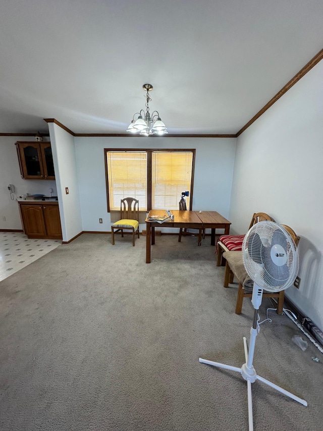 playroom with carpet flooring, baseboards, crown molding, and an inviting chandelier