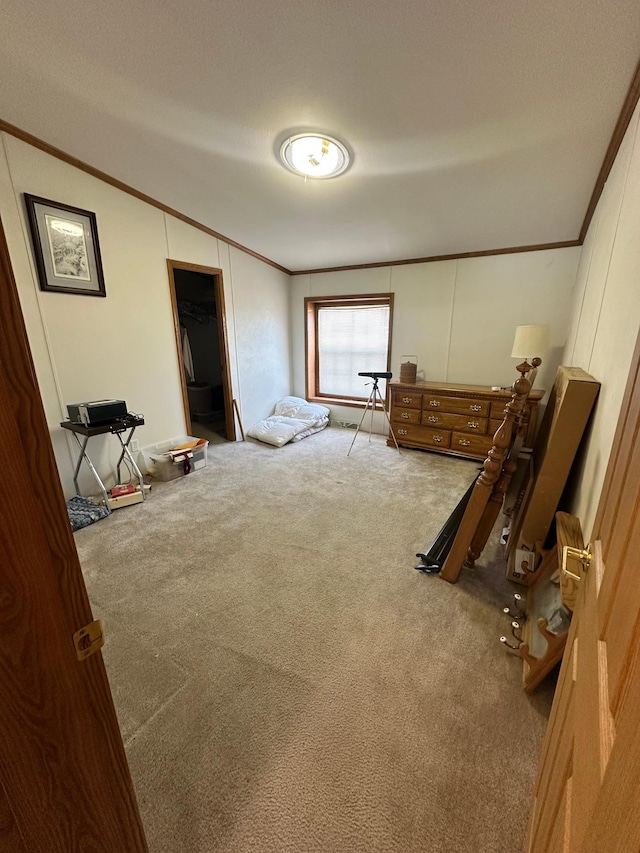 bedroom with carpet floors and ornamental molding