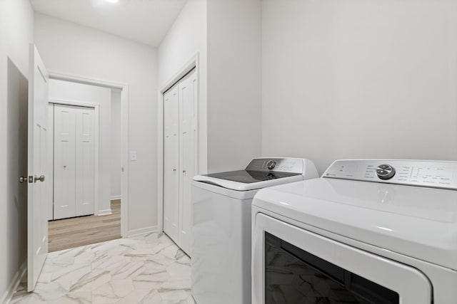 laundry area featuring washer and clothes dryer