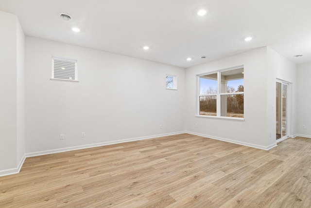 empty room with light hardwood / wood-style floors