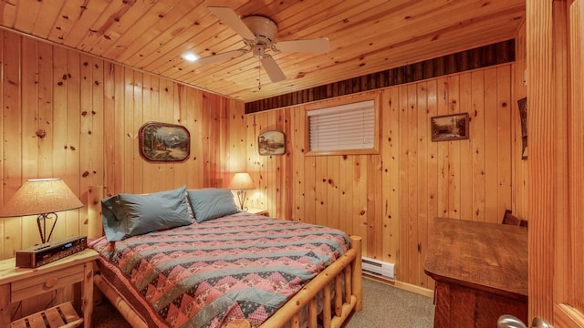 carpeted bedroom featuring wooden walls, wooden ceiling, and baseboard heating