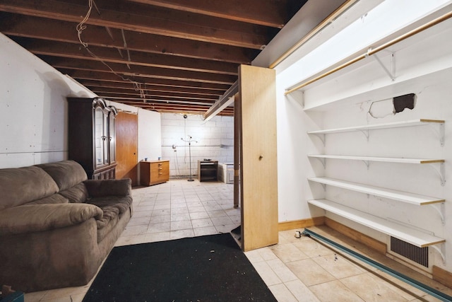 basement with light tile patterned floors