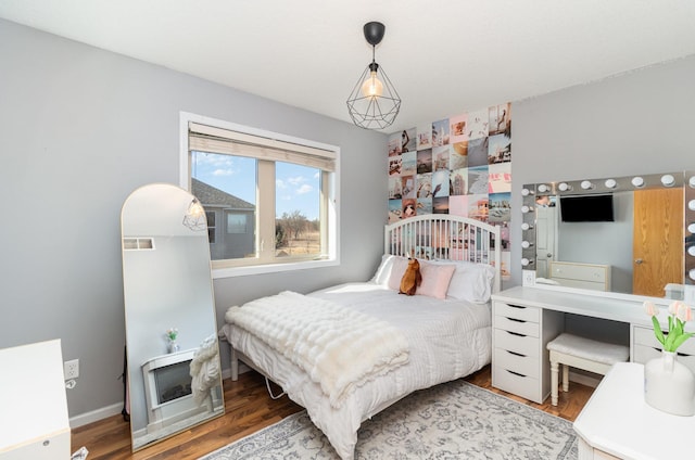 bedroom with wood-type flooring