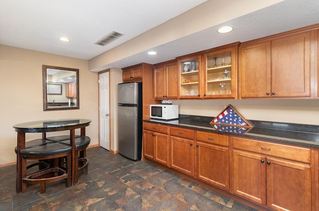 kitchen with stainless steel fridge