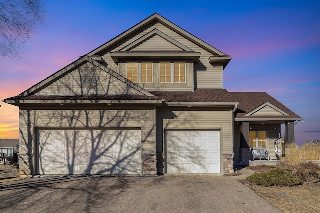 view of front of property with a garage and covered porch