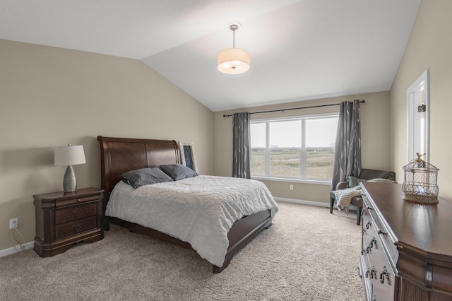 carpeted bedroom featuring vaulted ceiling