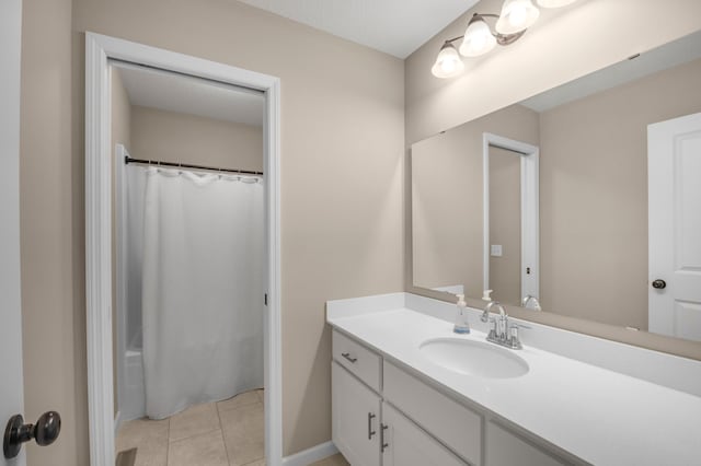 bathroom featuring a shower with curtain, vanity, and tile patterned flooring