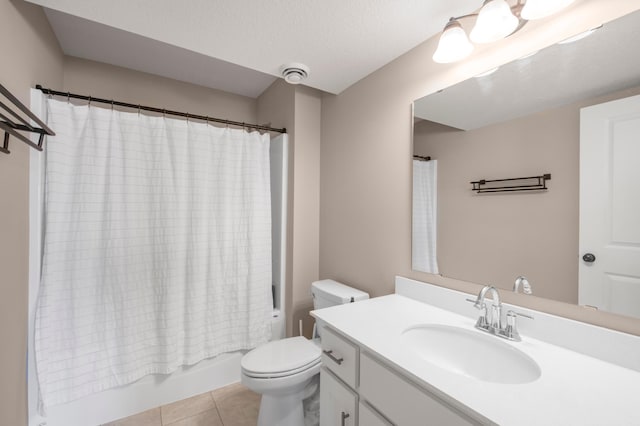 full bathroom featuring shower / tub combo with curtain, vanity, a textured ceiling, tile patterned floors, and toilet