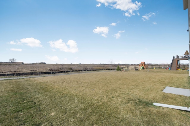 view of yard featuring a rural view and a playground