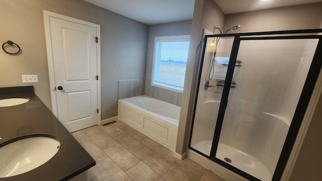 bathroom featuring vanity, tile patterned floors, and separate shower and tub