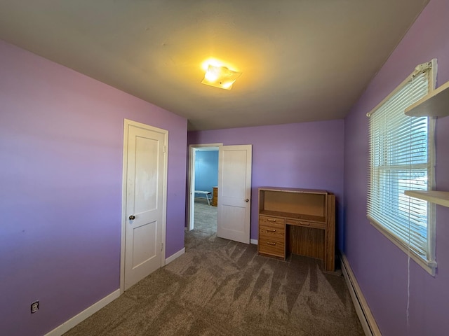 unfurnished bedroom featuring baseboards, carpet floors, and baseboard heating
