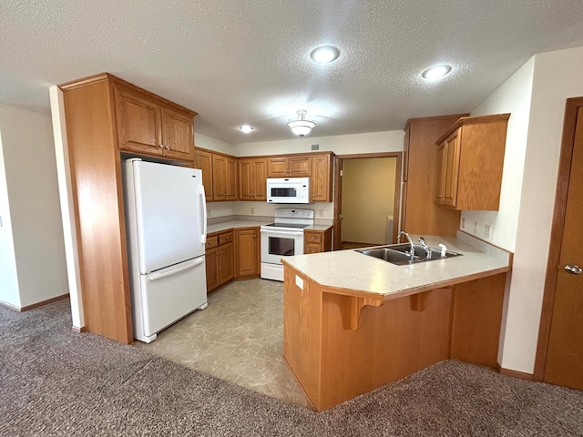 kitchen with a kitchen bar, sink, white appliances, kitchen peninsula, and light colored carpet